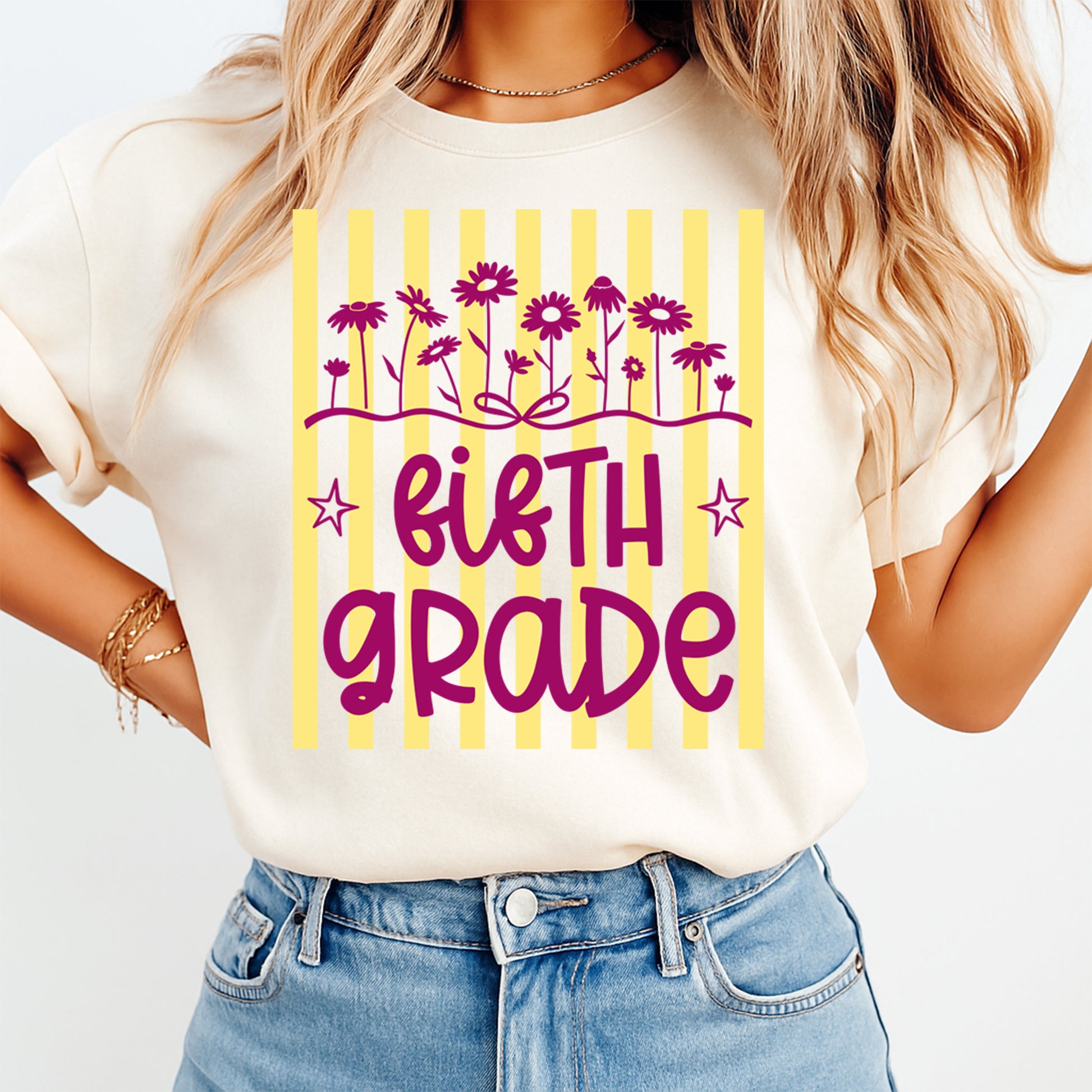 Person wearing a white t-shirt with "Fifth grade' design on a plain background