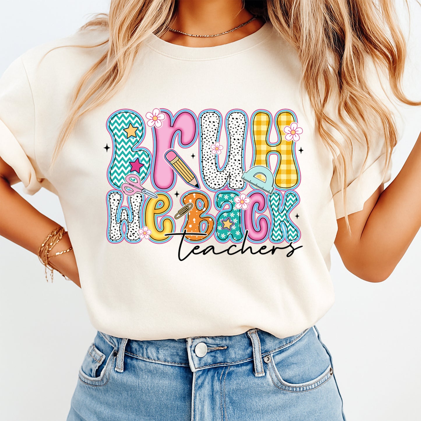 Person wearing a white t-shirt with colorful text design and denim shorts on a light background