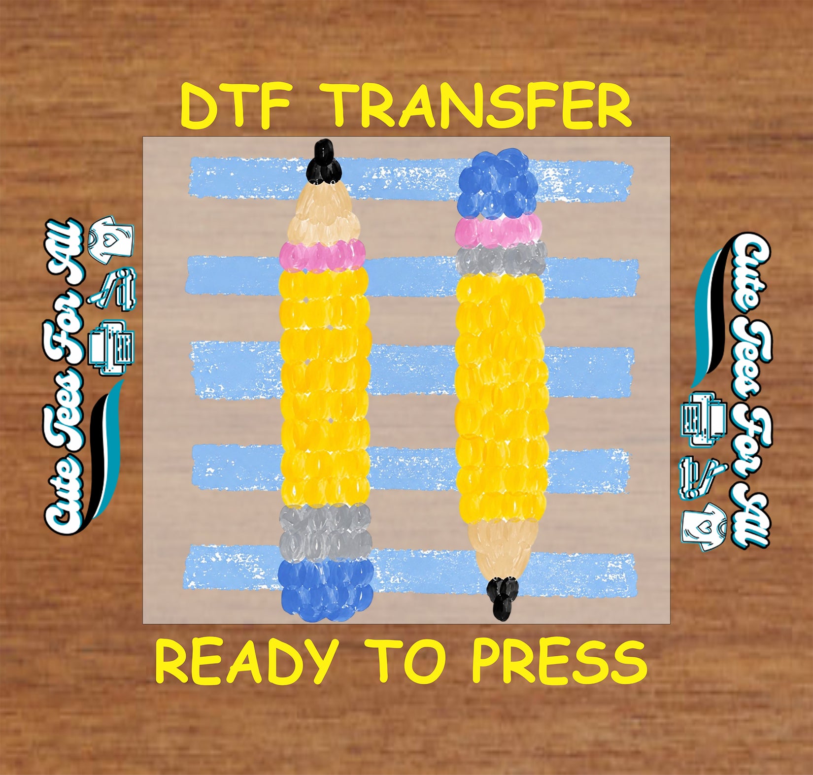 DTF transfer with two colorful pencils on a wooden background
