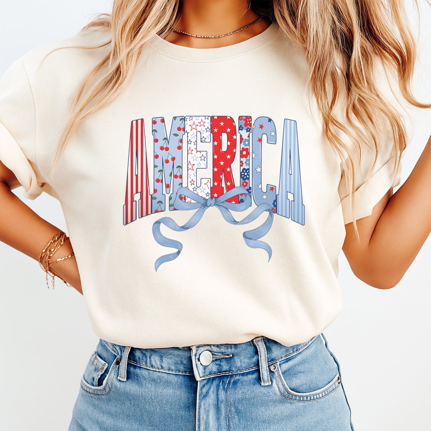 Woman wearing cream shirt with Fourth of July America bow DTF transfer featuring patriotic patterned lettering