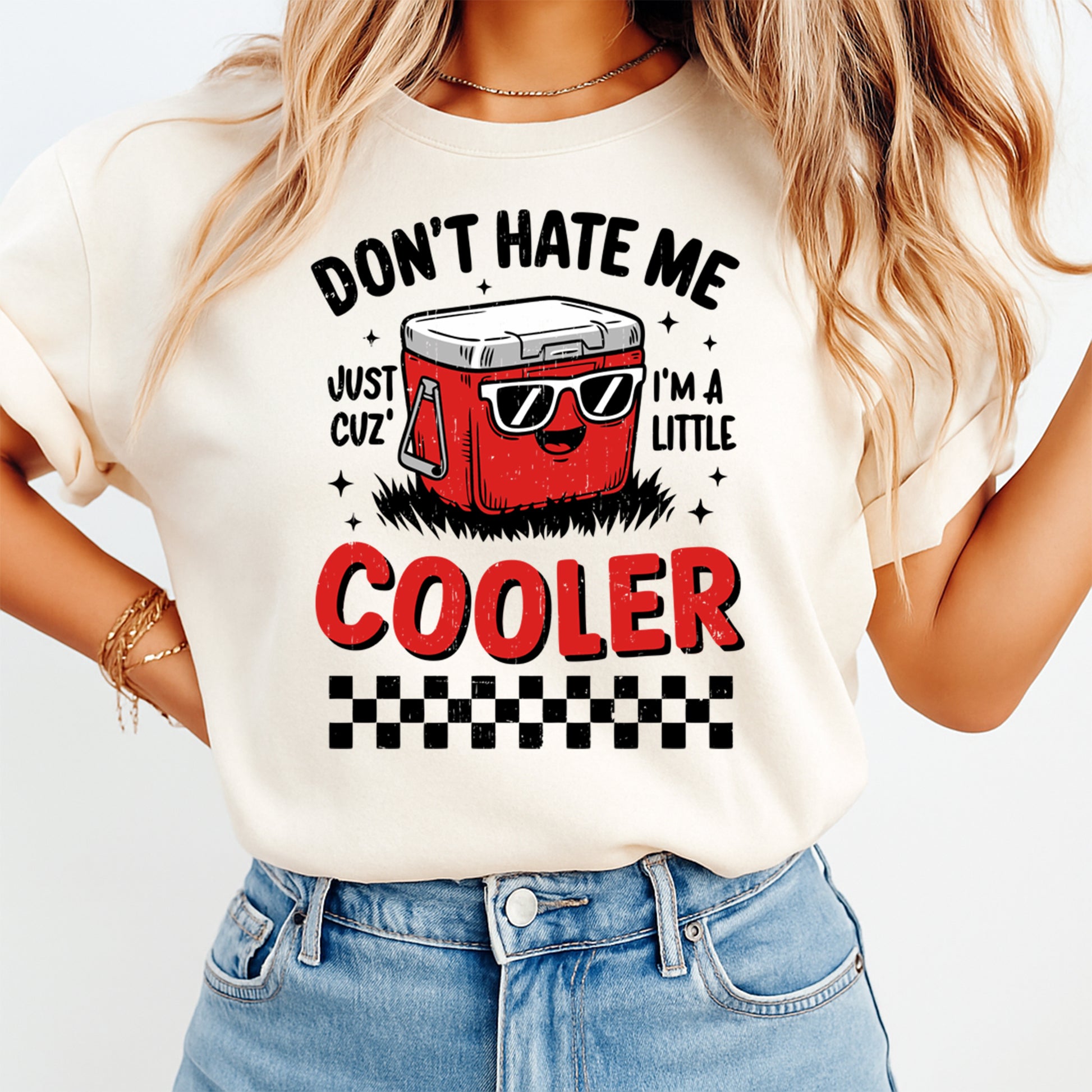 Person wearing a t-shirt with a graphic design of a cooler and text on a white background