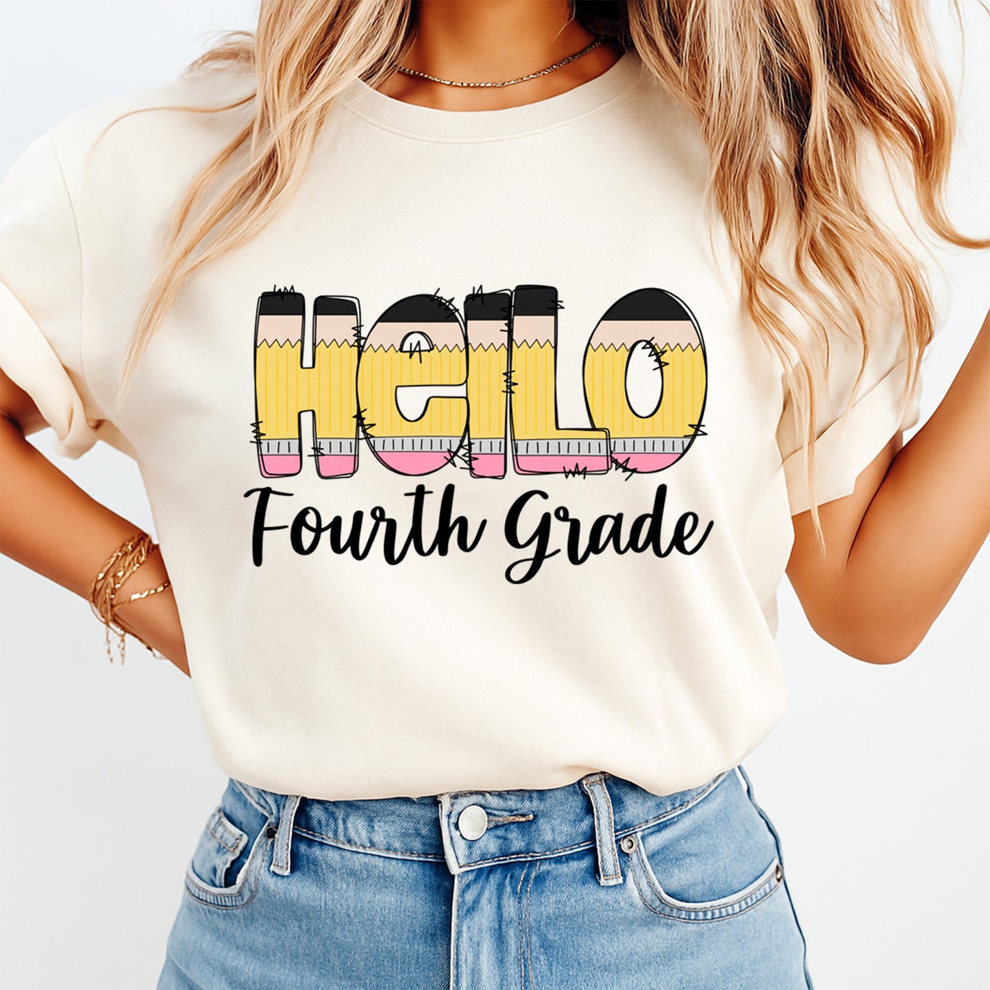 Person wearing a white t-shirt with 'Hello Fourth Grade' text and colorful pencils design.