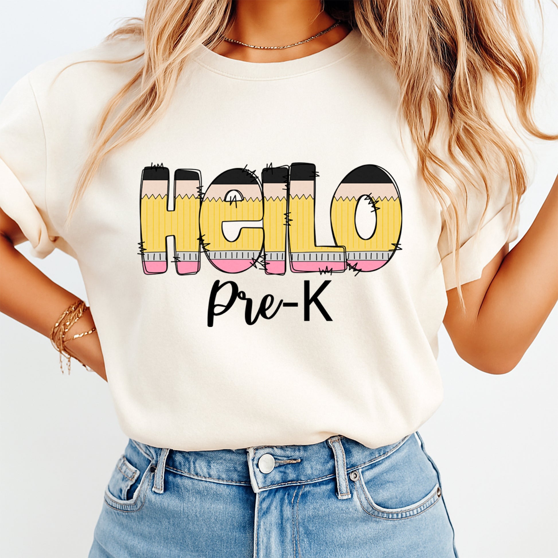 Person wearing a white t-shirt with 'HELLO Pre-K' text design.