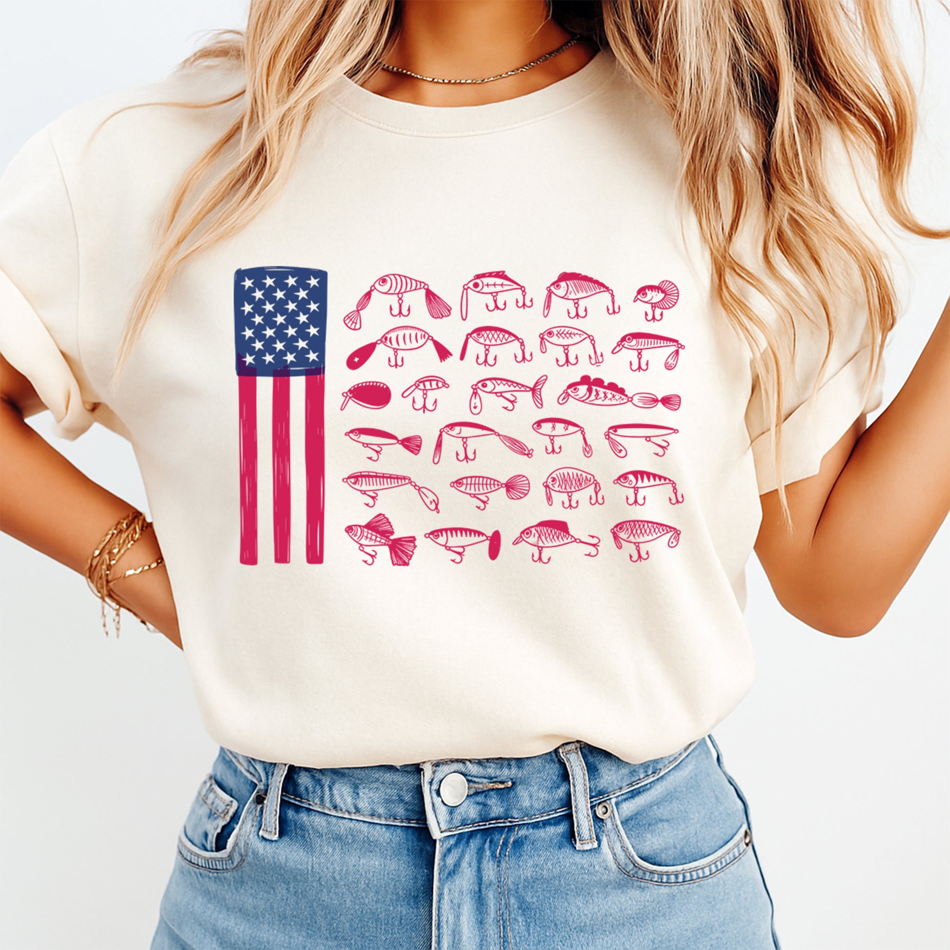 Person wearing a white t-shirt with an American flag and fish illustrations on a plain background