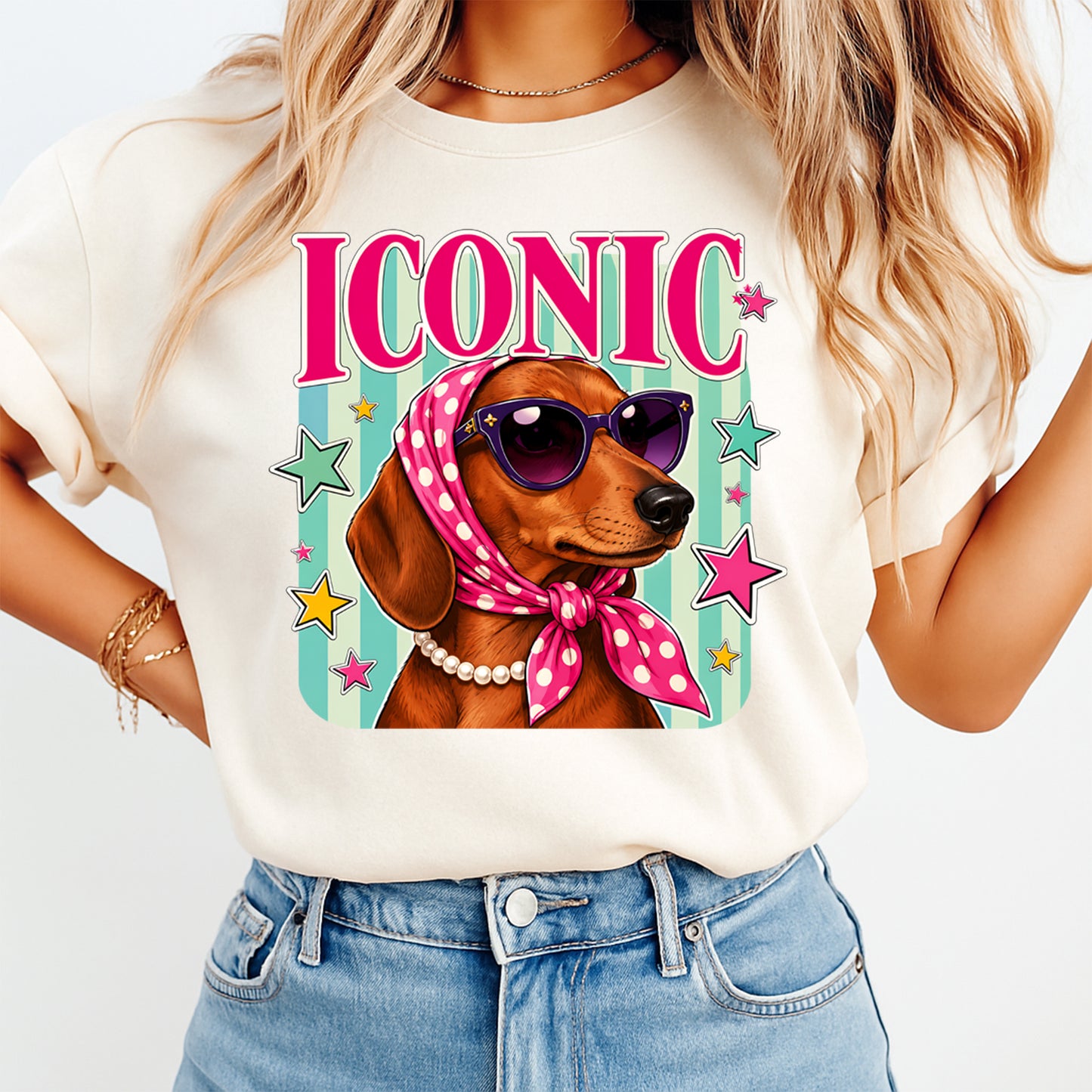 Person wearing a t-shirt with a dachshund graphic and 'ICONIC' text.