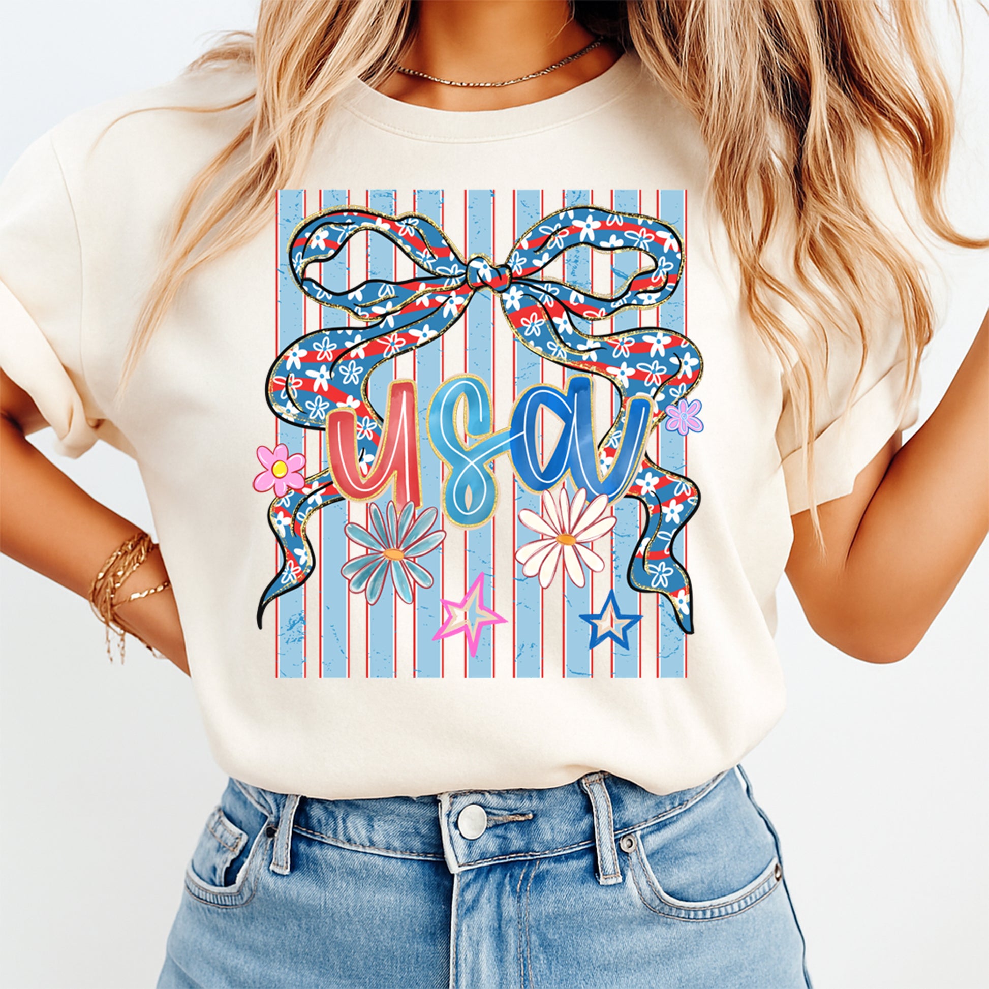 Person wearing a white t-shirt with a colorful graphic design featuring the word 'USA' on a white background.