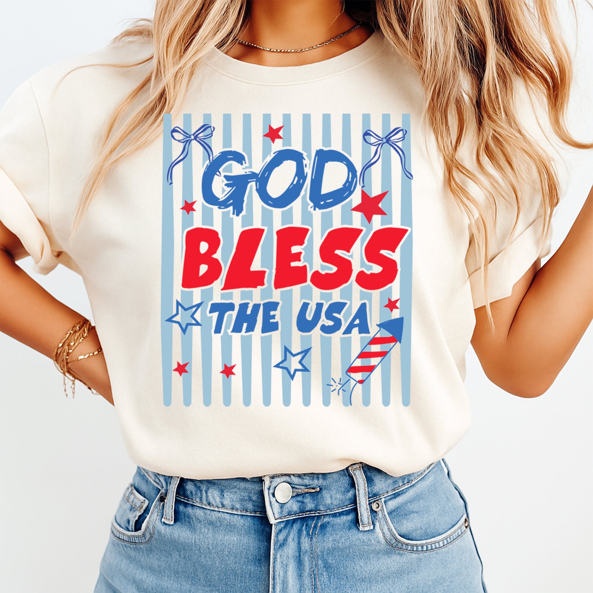 Person wearing a t-shirt with 'God Bless the USA' text and patriotic graphics.