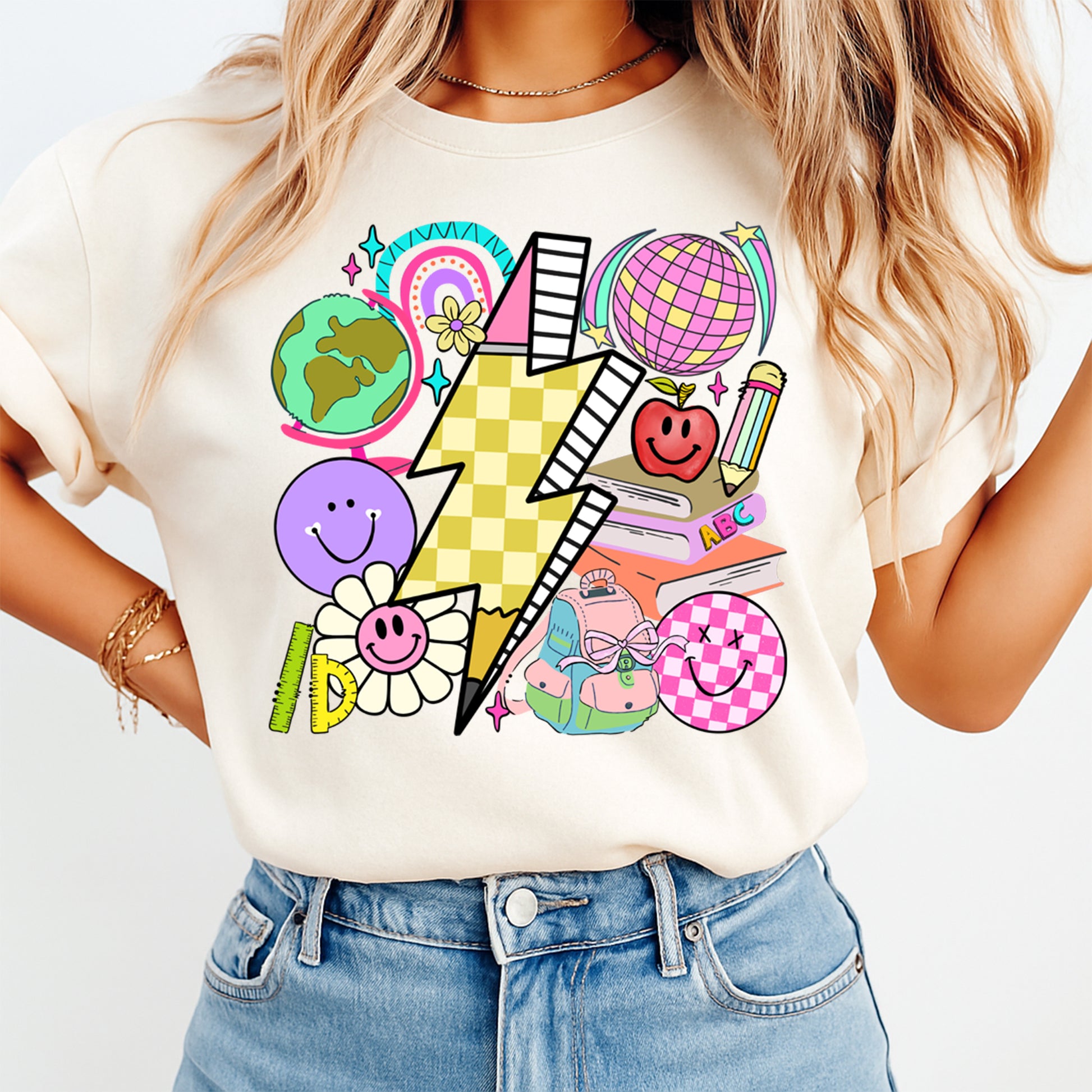 Person wearing a white t-shirt with colorful graphic design on a plain background