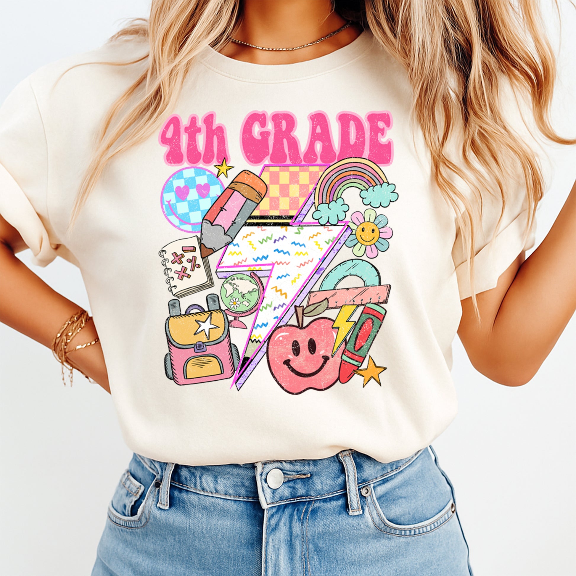 Person wearing a t-shirt with '4th Grade' design and colorful graphics on a white background