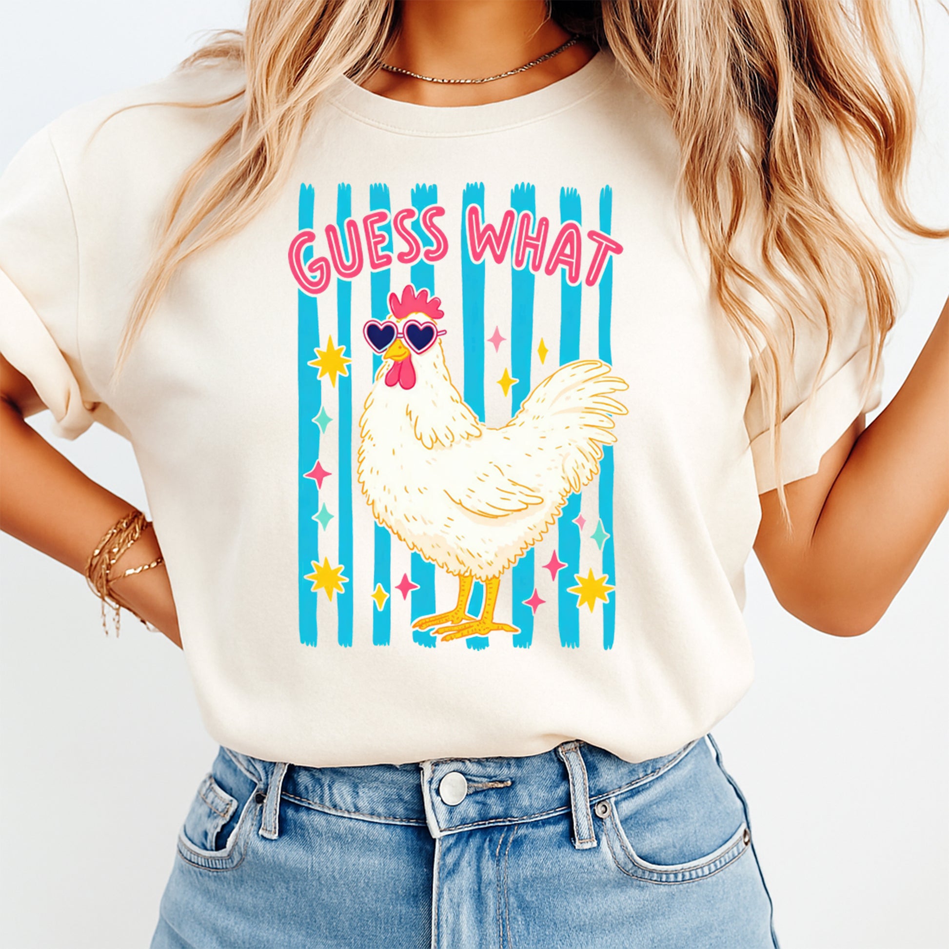 Person wearing a t-shirt with a chicken graphic and text on a plain background