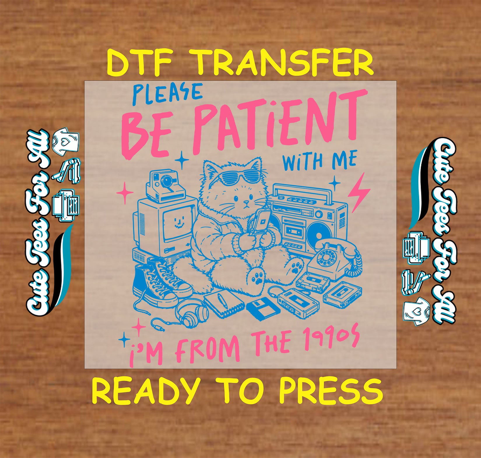 DTF transfer with a cat graphic and text on a wooden surface, featuring the brand 'Cute Tees For All'.