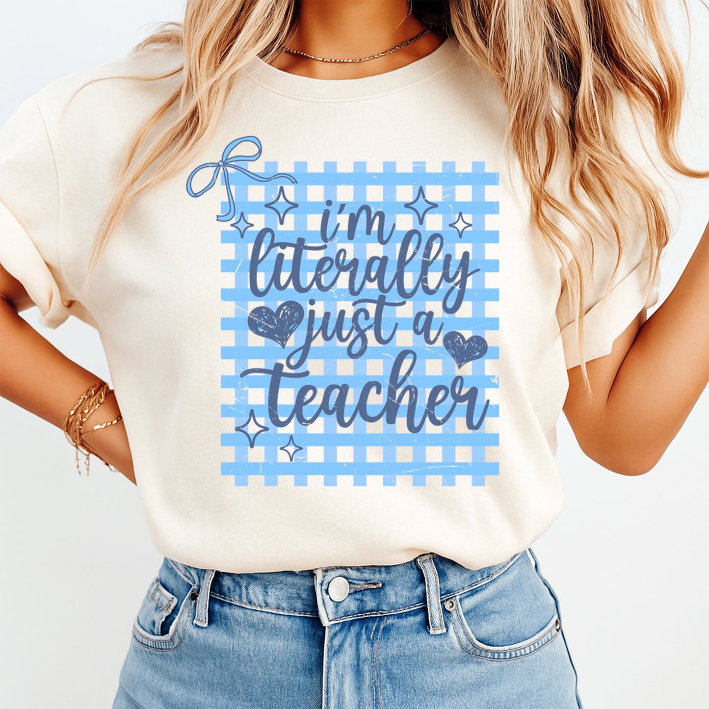 Person wearing a t-shirt with 'I'm literally just a teacher' text design.