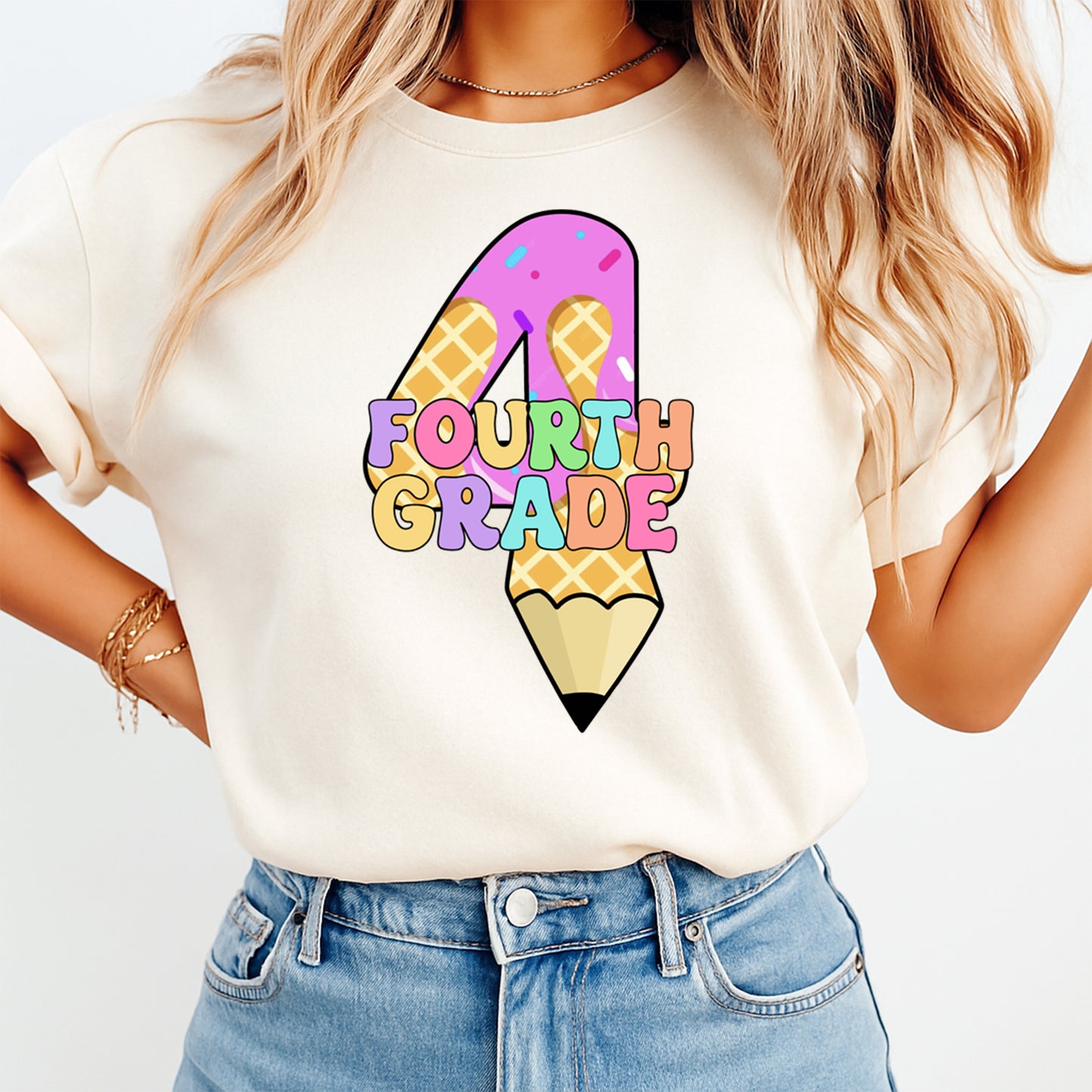 Person wearing a white t-shirt with a colorful 'Fourth Grade' design on a plain background