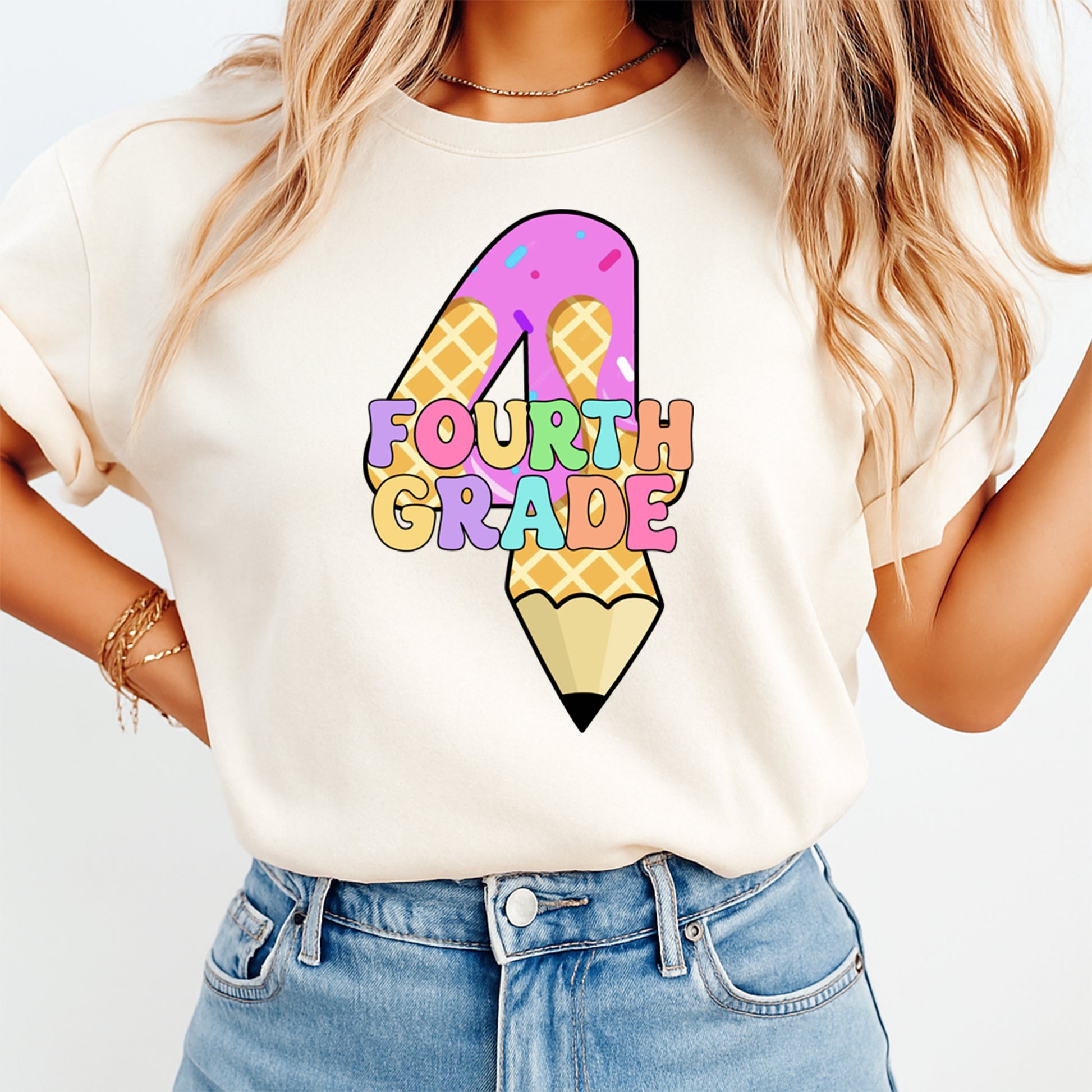 Person wearing a white t-shirt with a colorful 'Fourth Grade' design on a plain background