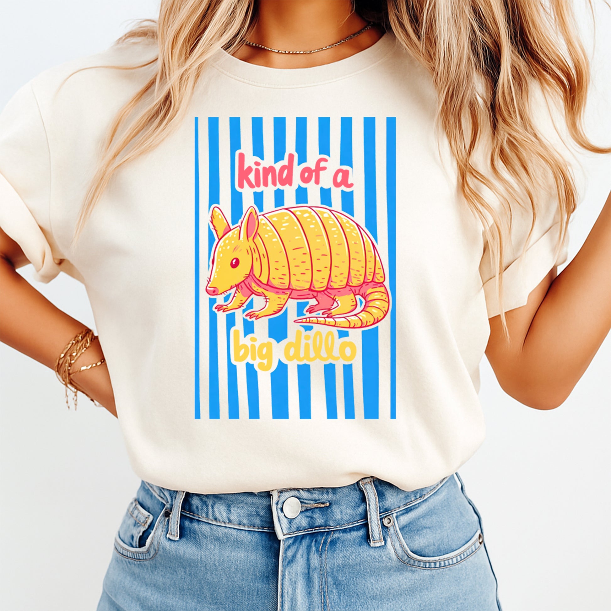 Person wearing a t-shirt with an armadillo graphic and text on a white background
