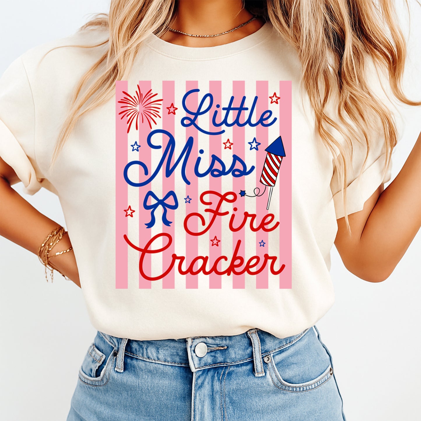 Person wearing a t-shirt with 'Little Miss Firecracker' design on a white background