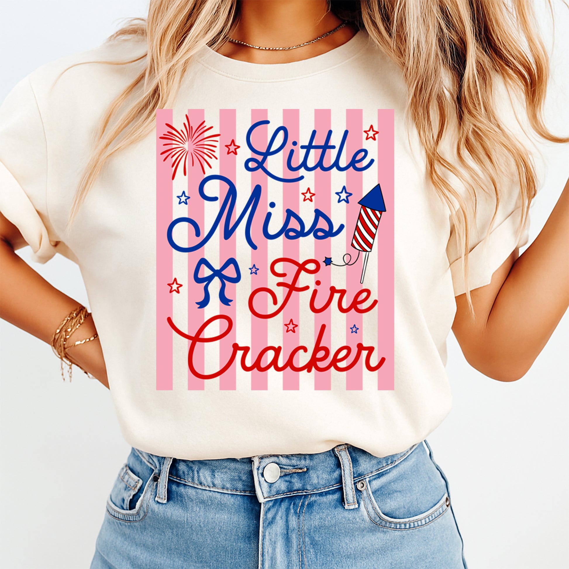Person wearing a t-shirt with 'Little Miss Firecracker' design on a white background