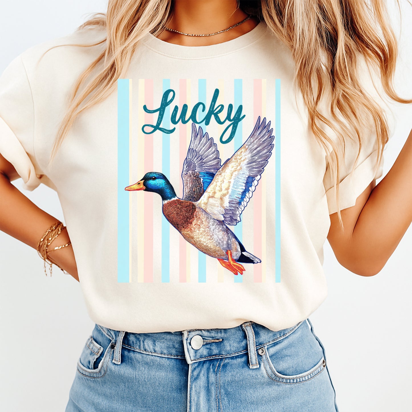 Person wearing a t-shirt with a duck graphic and 'Lucky' text on a white background