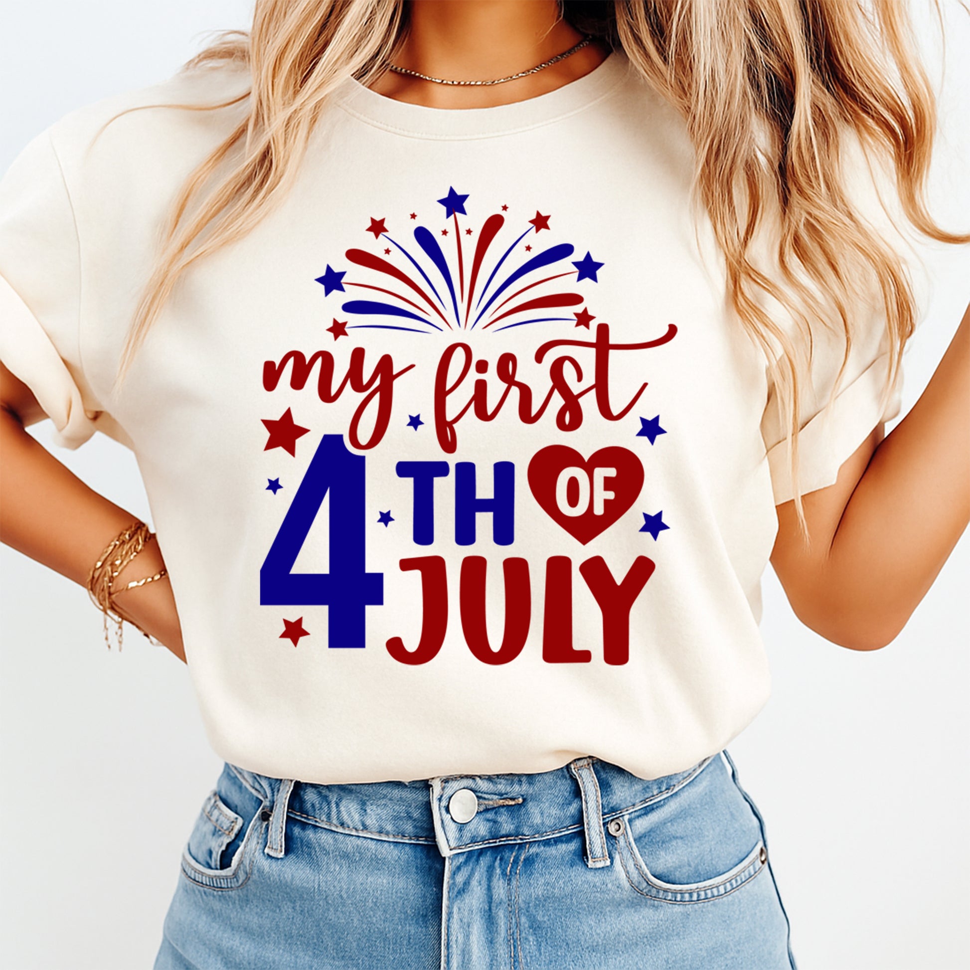 Person wearing a white t-shirt with 'my first 4th of July' text and patriotic graphics.