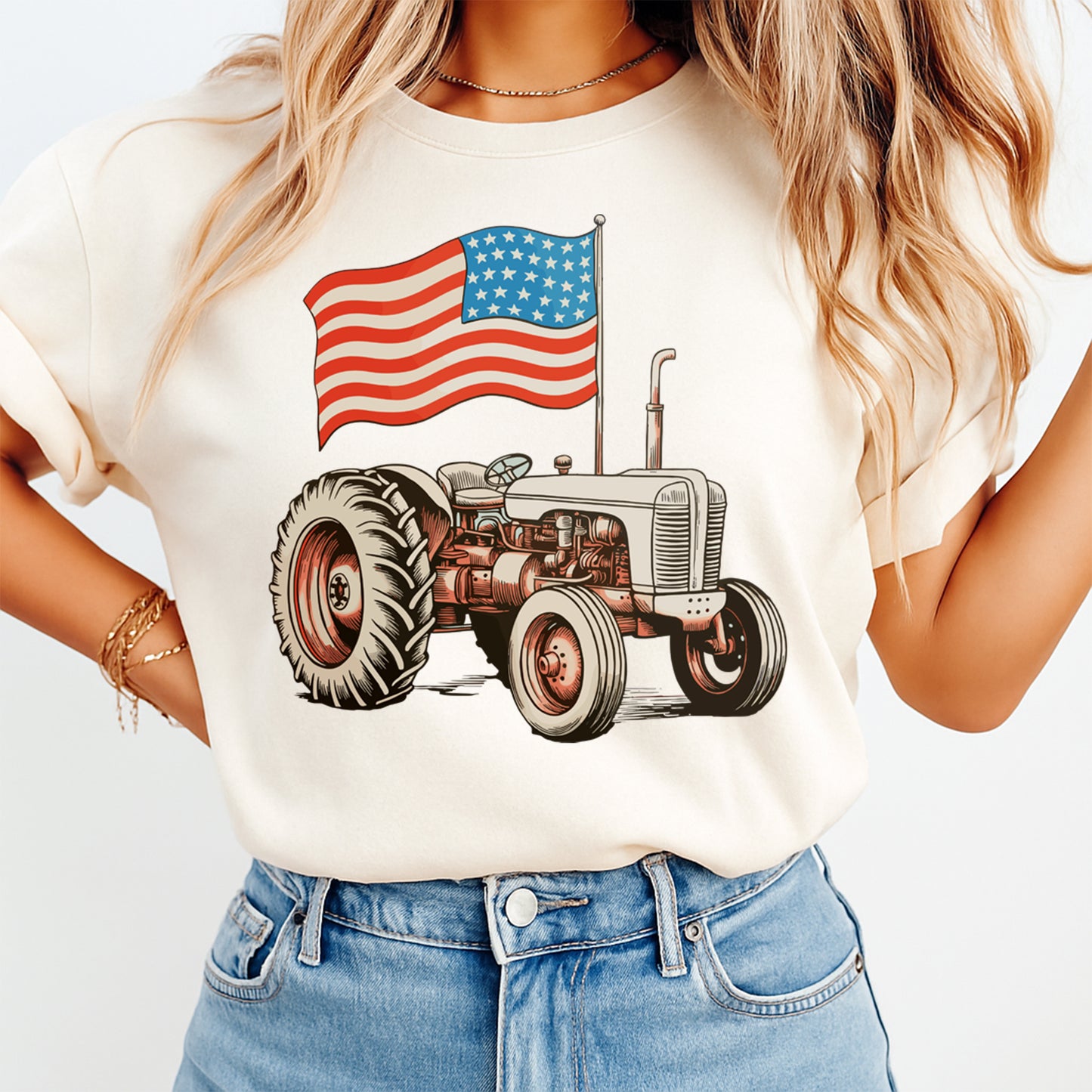 Person wearing a t-shirt with a tractor and American flag design.