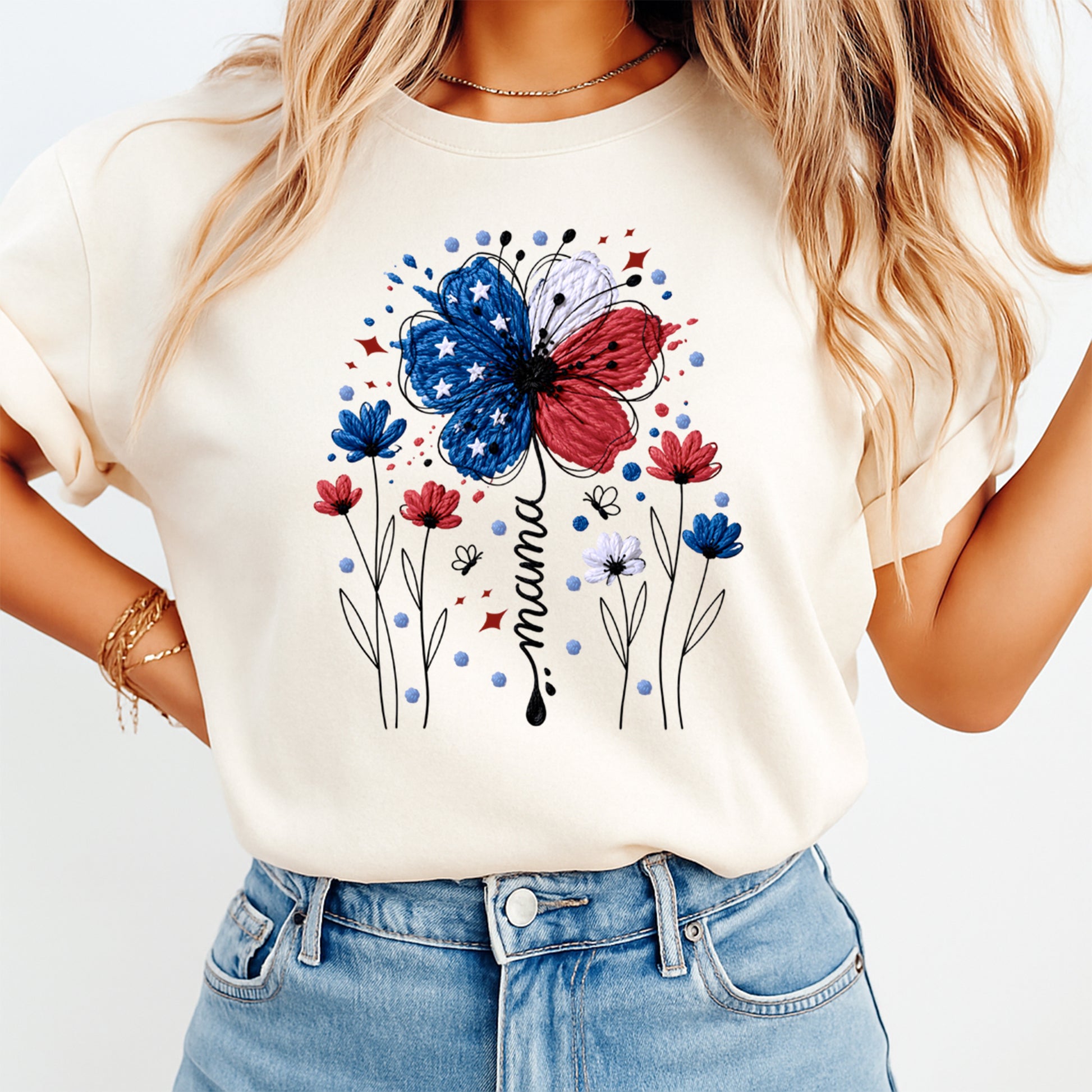 Person wearing a white t-shirt with a colorful butterfly and flower design, and blue jeans.