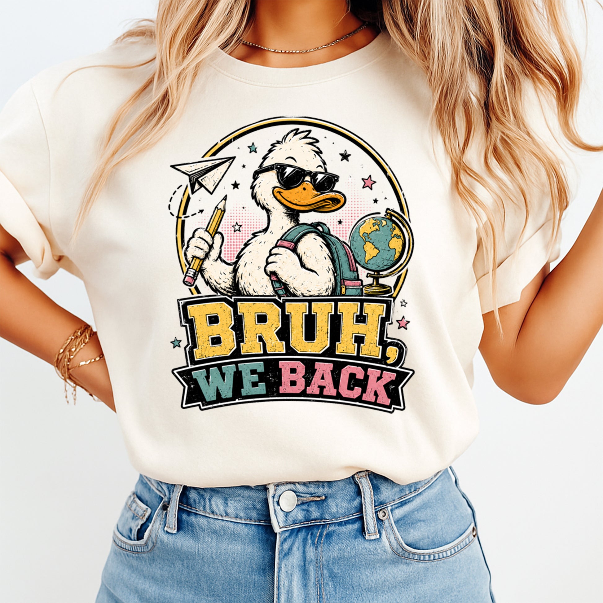 Person wearing a white t-shirt with a cartoon duck design and 'BRUH, WE BACK' text.