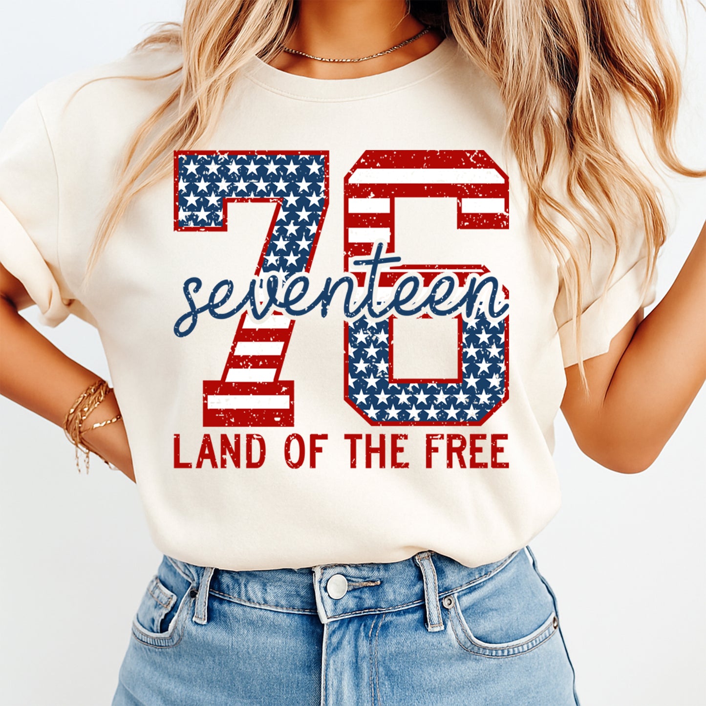 Fourth of July 1776 Land Of The Free DTF transfer mockup on cream shirt with distressed red white blue numbers, seventeen script text, and patriotic flag design.