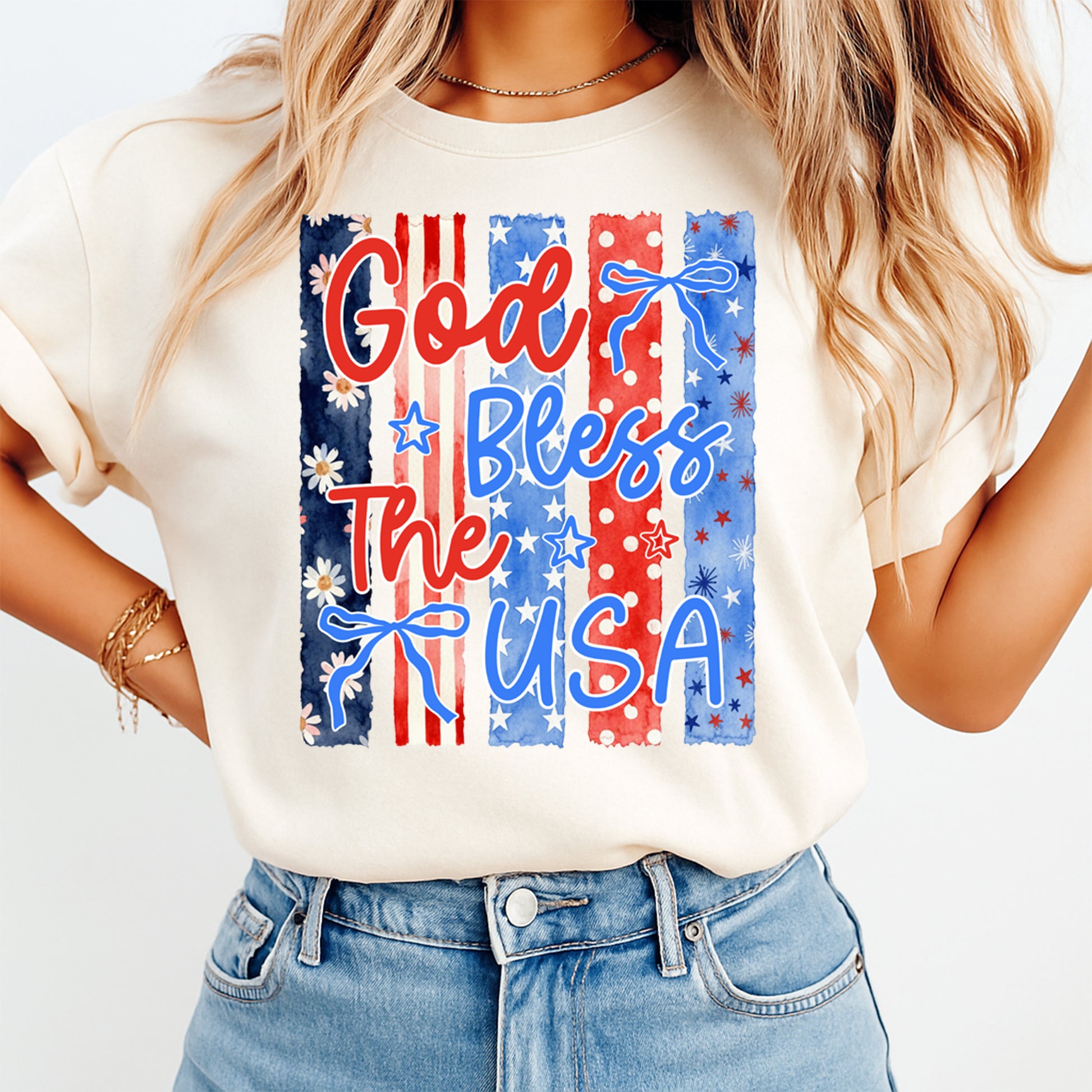 Person wearing a white t-shirt with 'God Bless The USA' design on a plain background