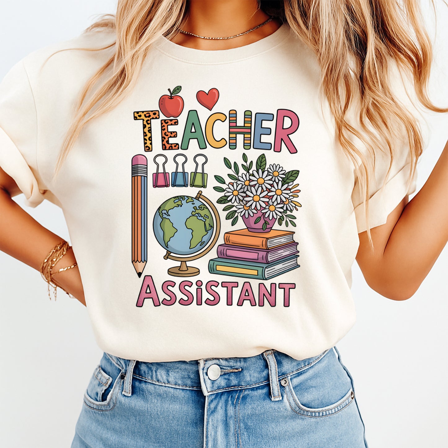 Person wearing a white t-shirt with 'Teacher Assistant' design on a plain background