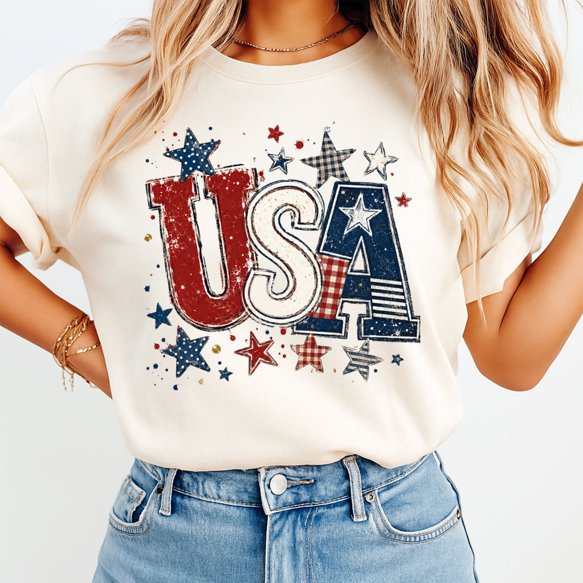Person wearing a white t-shirt with 'USA' and star design on a plain background