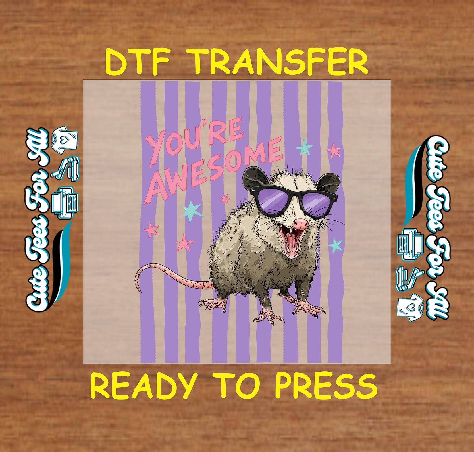 Opossum with sunglasses and 'You're Awesome' text on a DTF transfer with branding on a wooden background