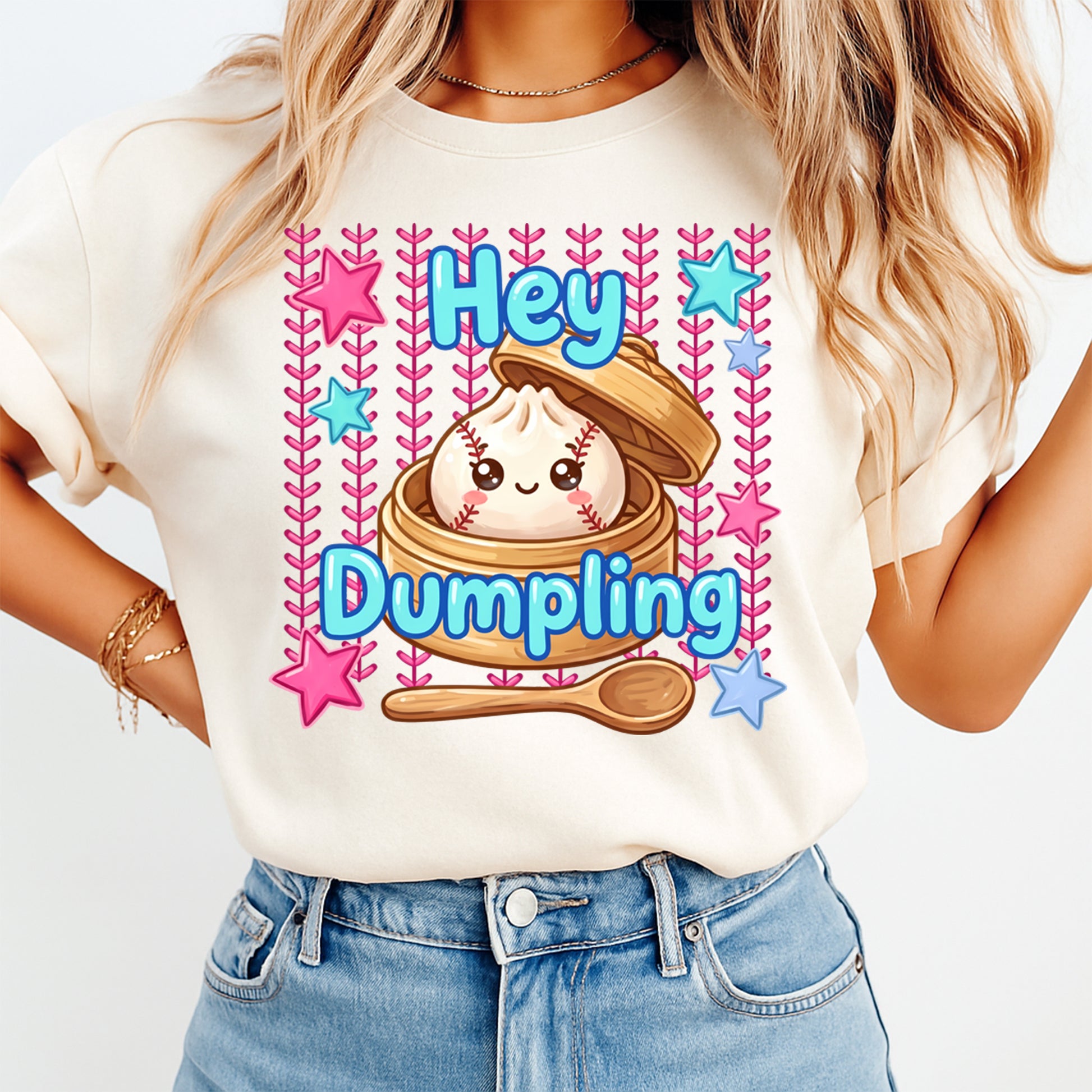 Person wearing a t-shirt with a cartoon dumpling design and text 'Hey Dumpling' on a plain background