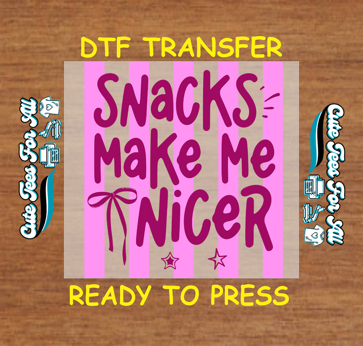 DTF transfer with 'Snacks Make Me Nicer' text on a wooden background