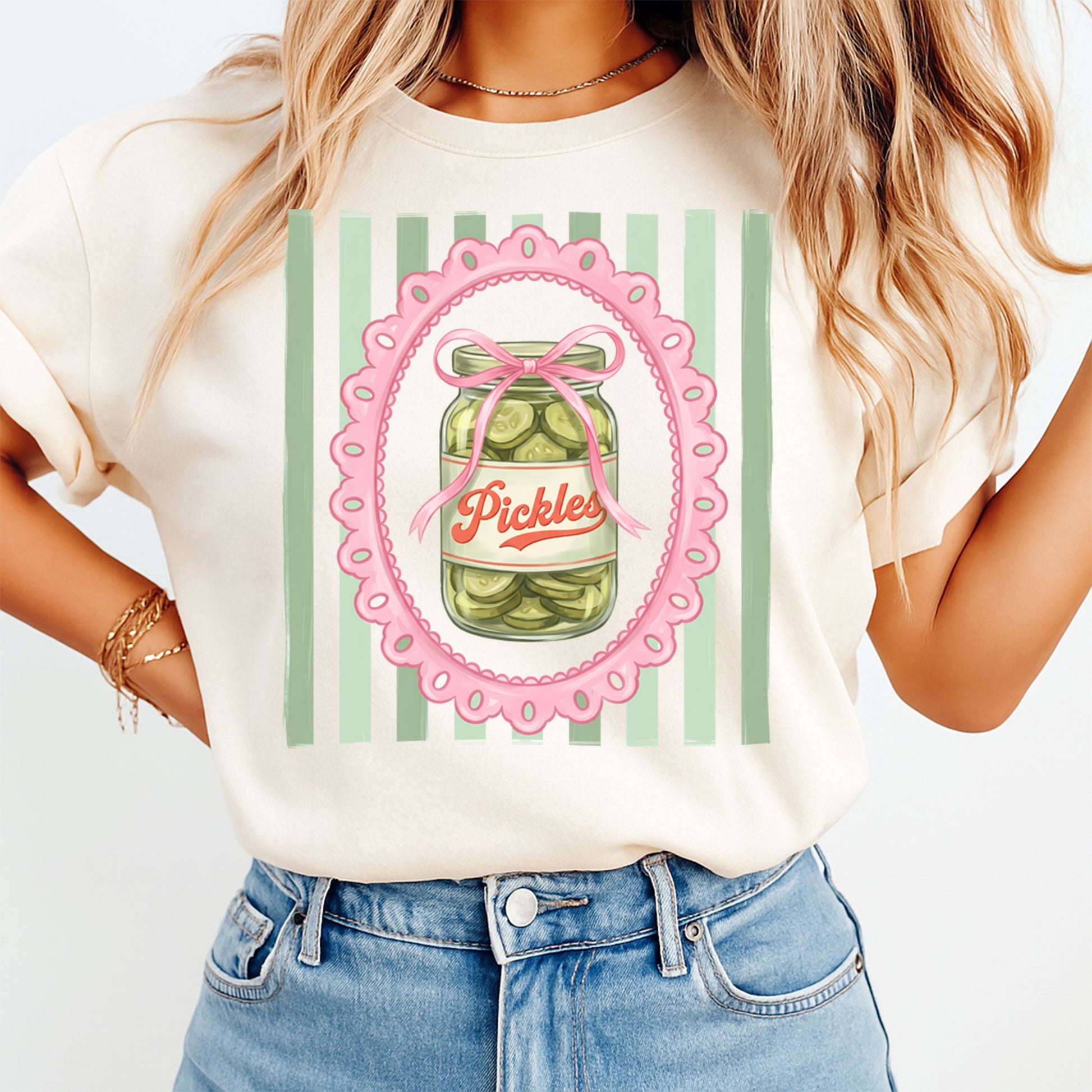 Person wearing a t-shirt with a pickle jar graphic and 'Pickles' text on a white background