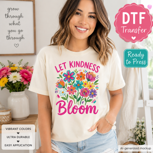 Woman wearing a t-shirt with 'Let Kindness Bloom' design, surrounded by flowers and decor.