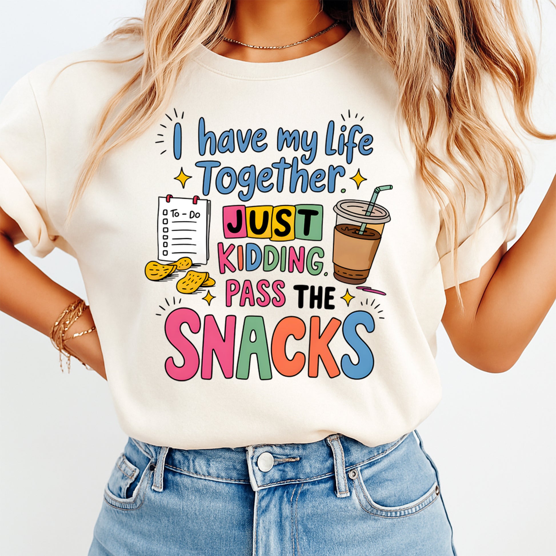 Person wearing a t-shirt with colorful text and graphics on a white background