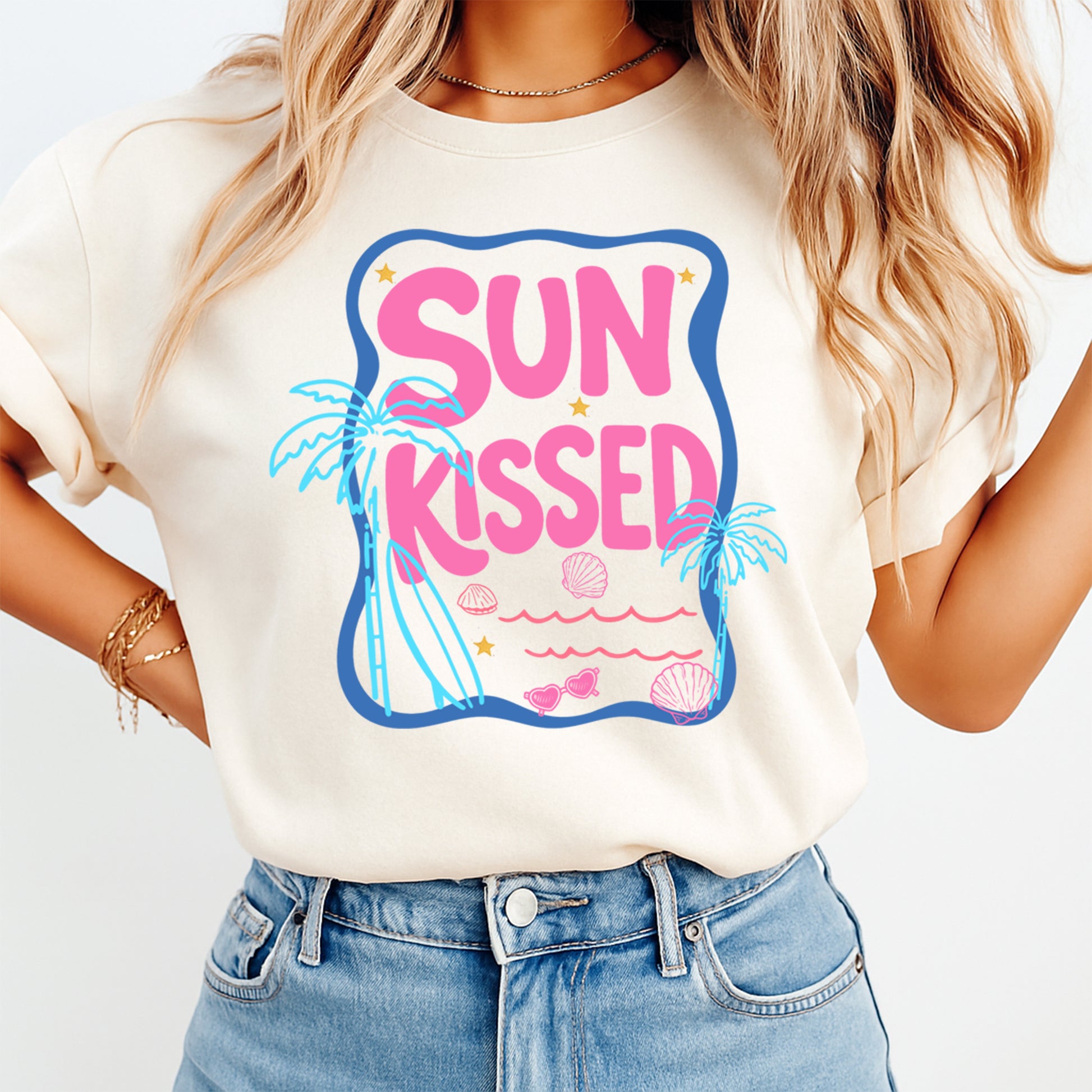 Person wearing a white t-shirt with 'Sun Kissed' design on a plain background