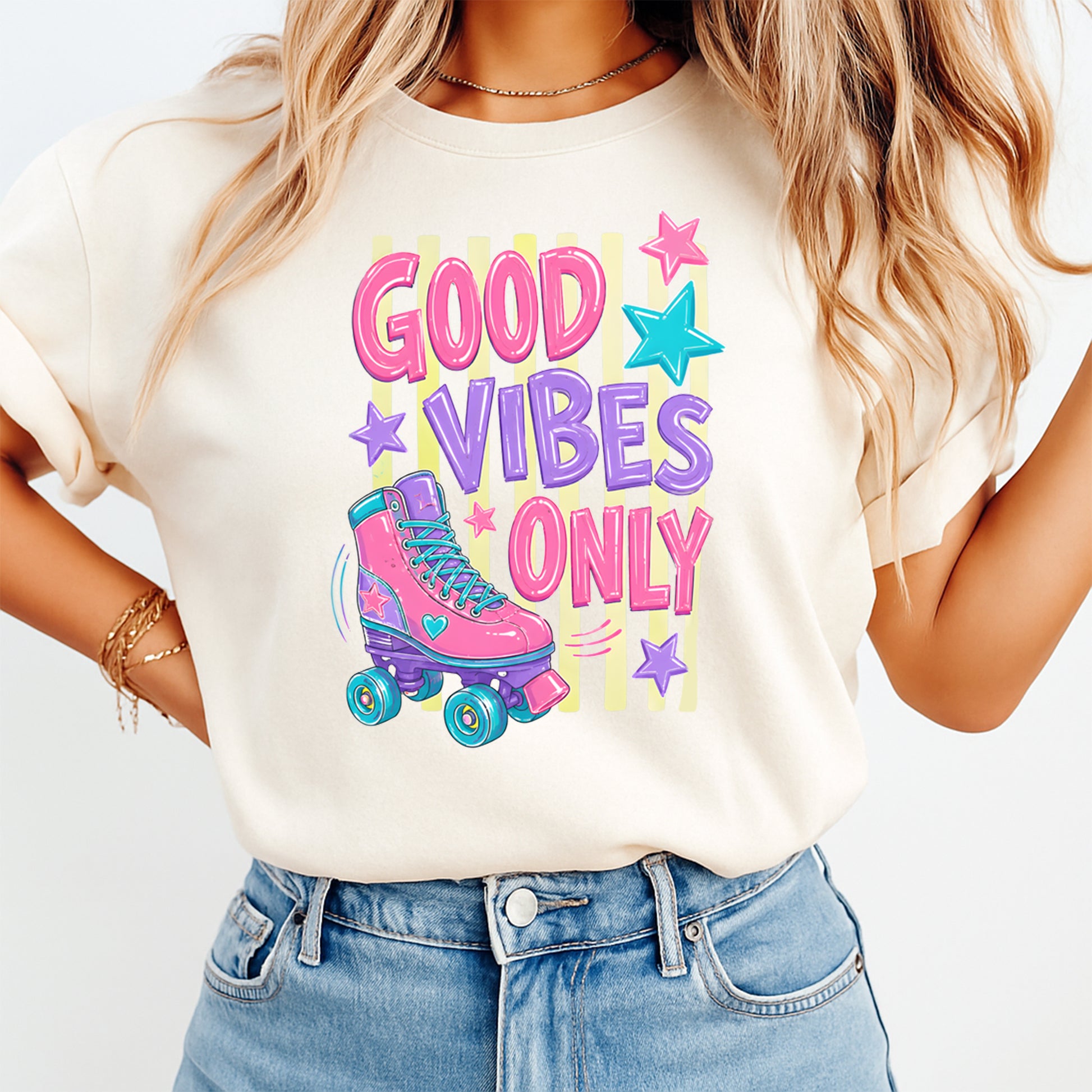 Person wearing a t-shirt with 'Good Vibes Only' and a roller skate graphic.