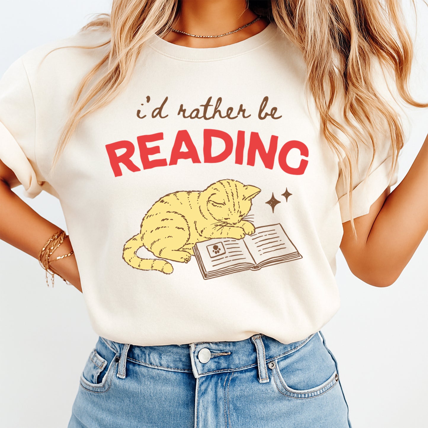 Real lifestyle mockup of an I’d Rather Be Reading cat DTF transfer on a shirt, ready to press book lover iron on design for DIY shirts