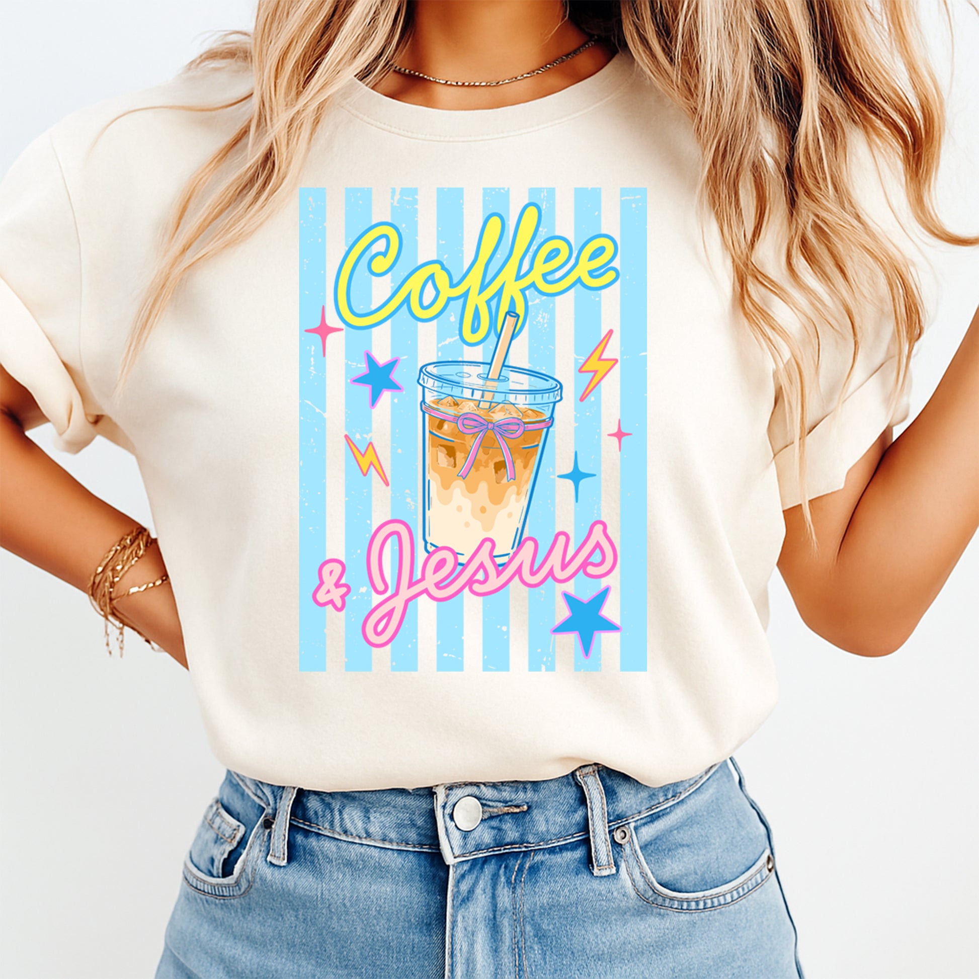 Person wearing a t-shirt with 'Coffee & Jesus' design on a plain background
