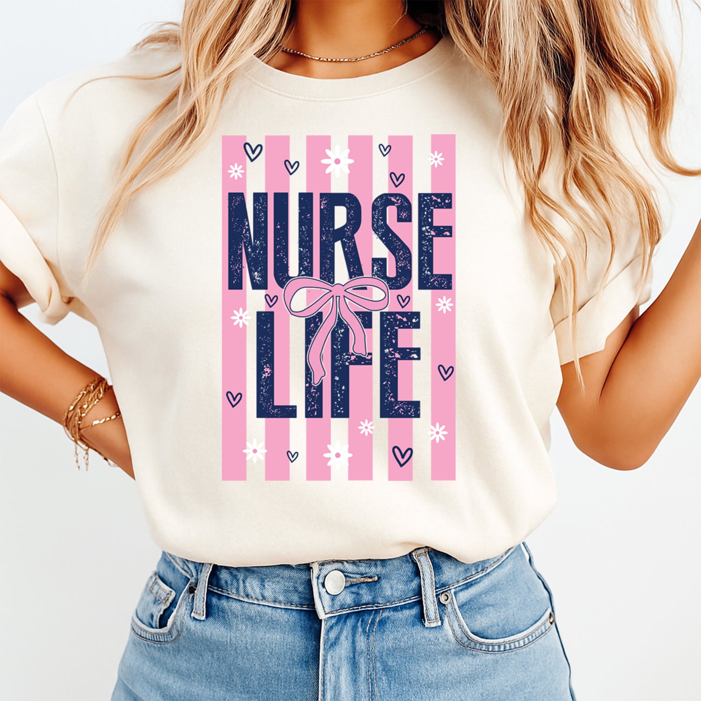 Person wearing a t-shirt with 'Nurse Life' design on a plain background