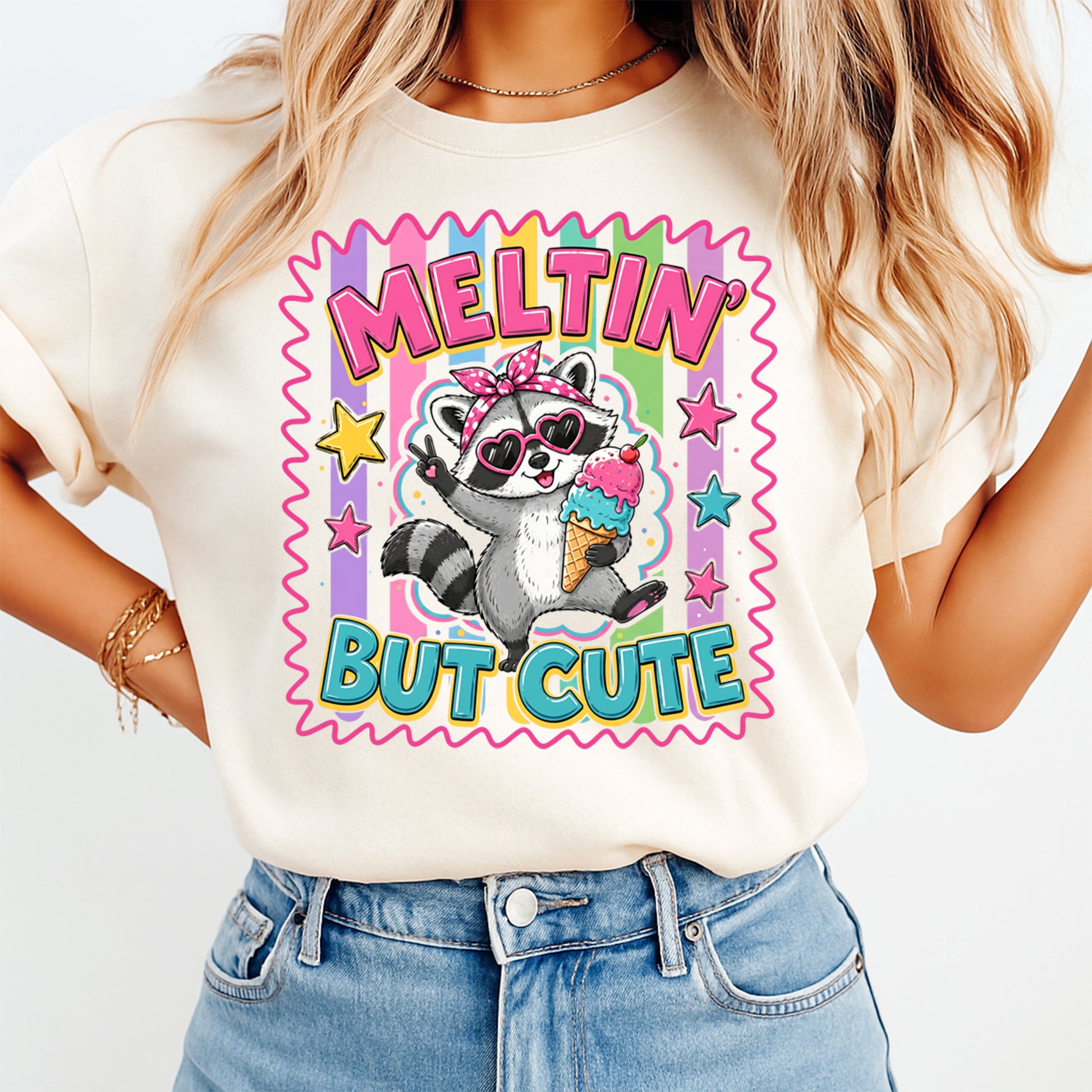 Person wearing a t-shirt with a raccoon graphic and text 'Meltin' But Cute' on a plain background