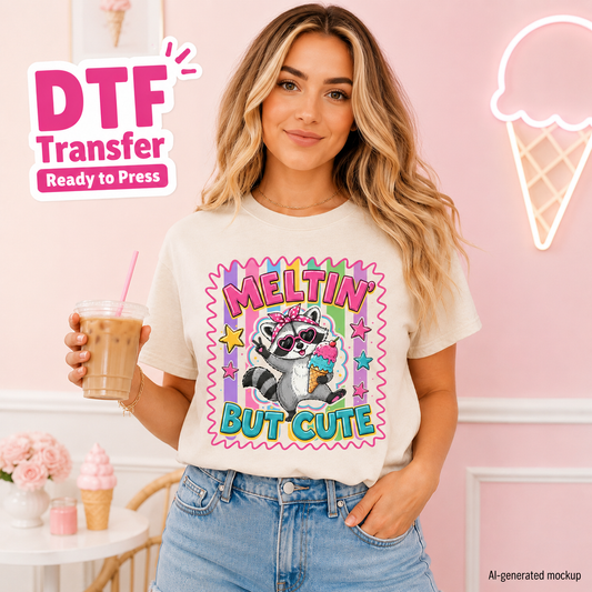Woman wearing a t-shirt with a raccoon graphic and text, holding a drink in a pink-themed setting.