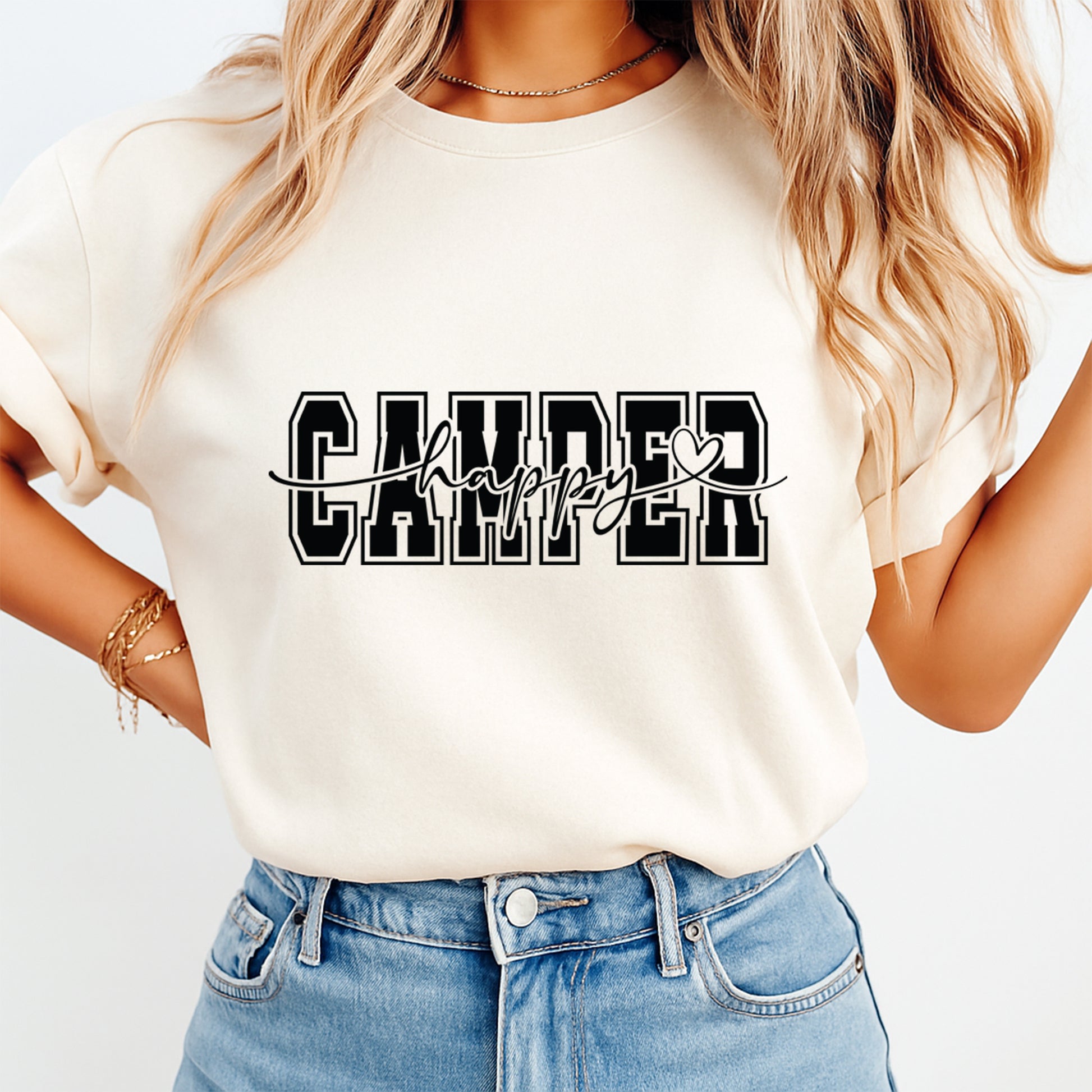 Person wearing a white t-shirt with 'Camper Happy' text design on a plain background