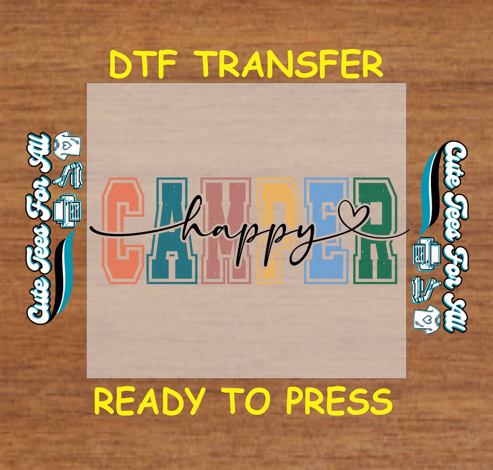 DTF transfer with 'Happy Camper' text on a wooden background
