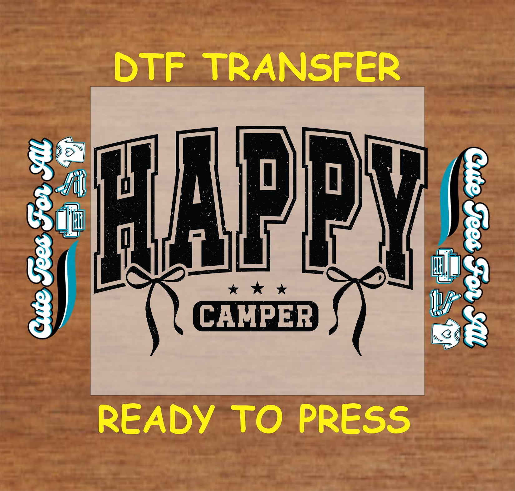 DTF transfer with 'Happy Camper' design on a wooden background