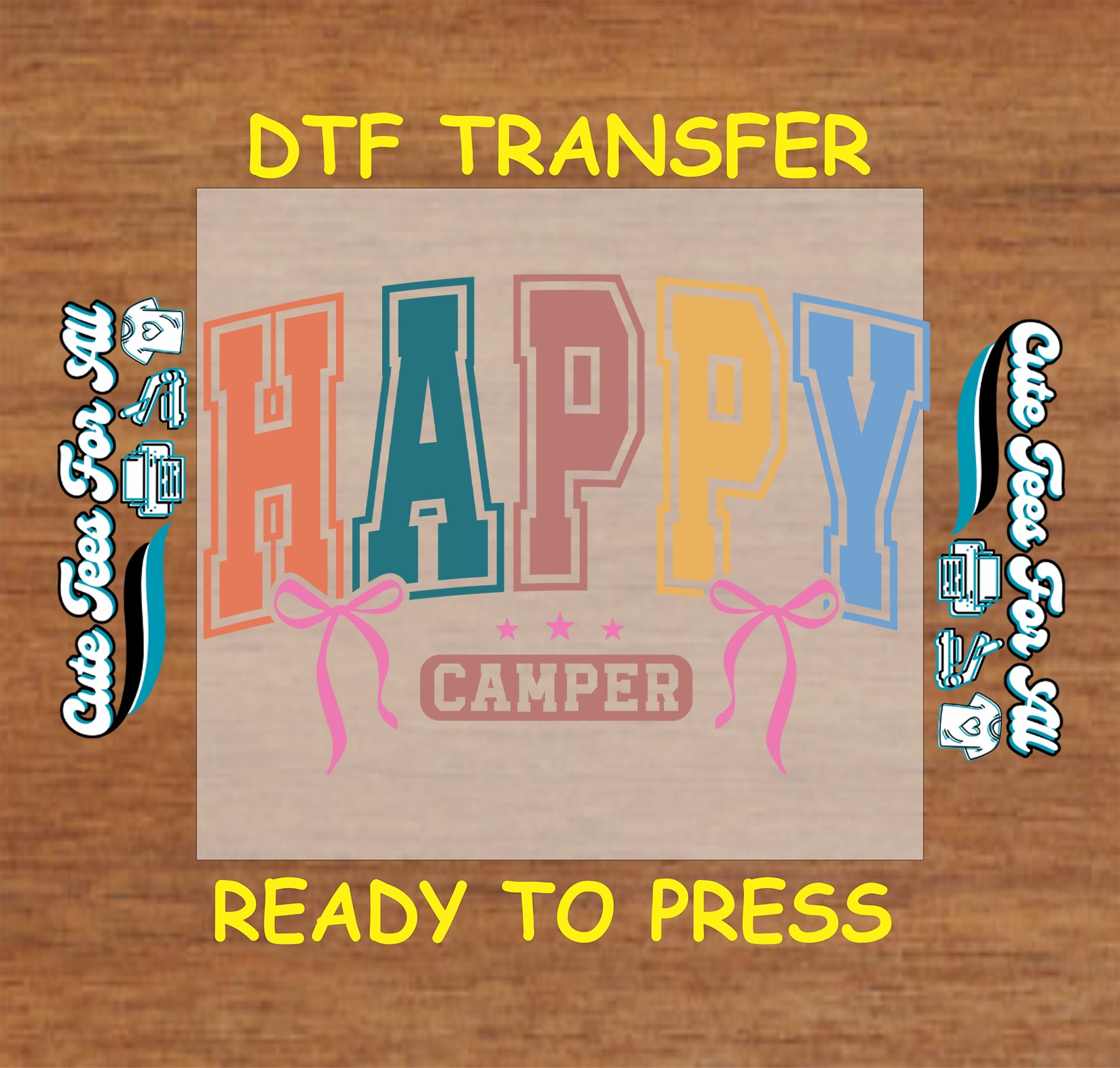 DTF transfer with 'Happy Camper' text on a wooden background