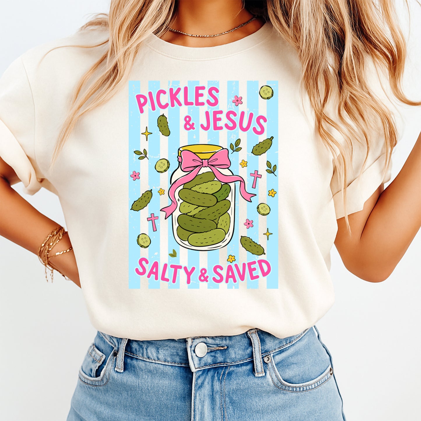 Person wearing a t-shirt with 'Pickles & Jesus Salty & Saved' design.