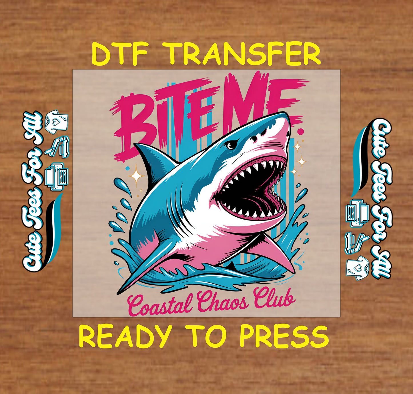 Shark graphic with 'Bite Me' text on a DTF transfer sheet, ready to press, on a wooden background.