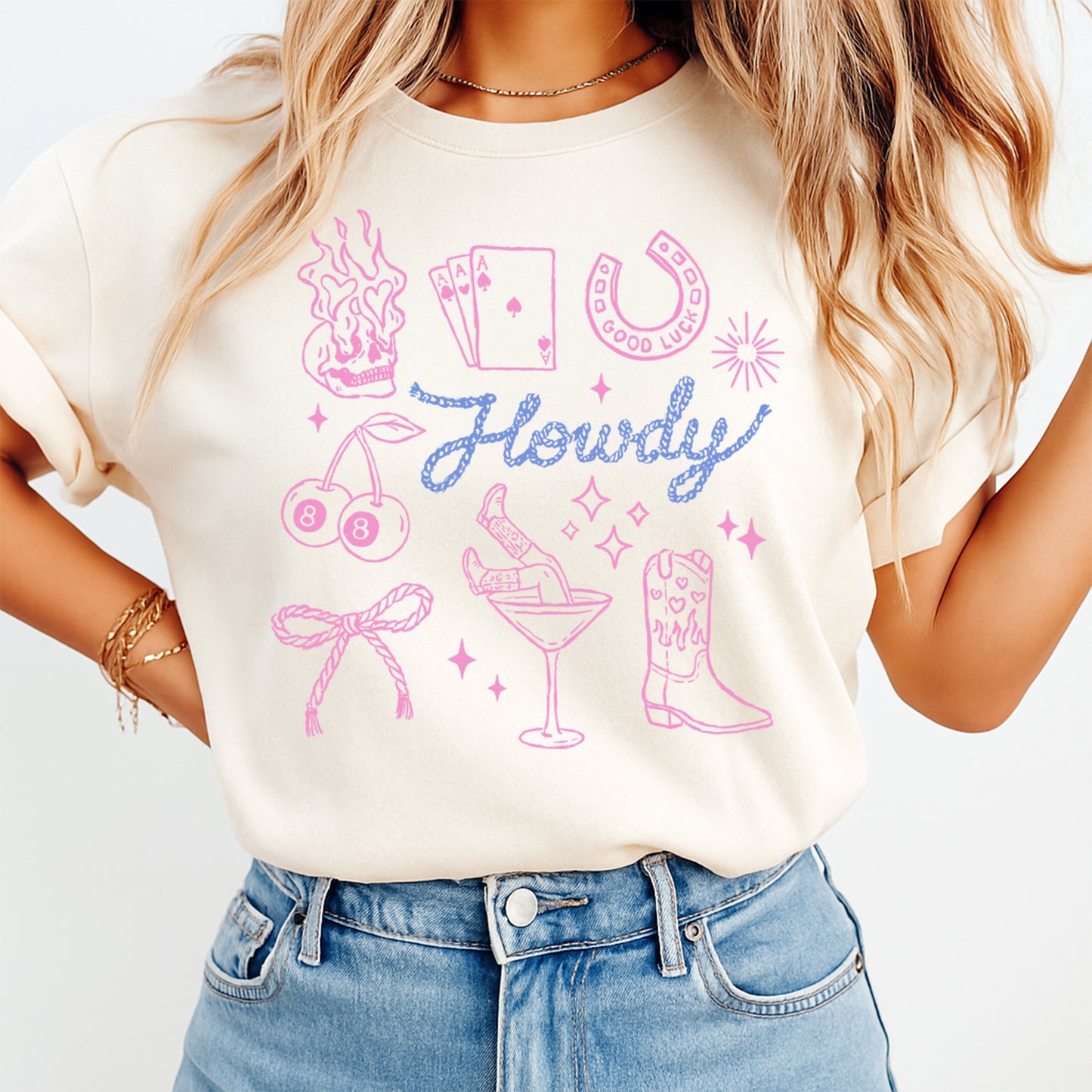 Person wearing a white t-shirt with colorful graphics and the word 'Howdy' on a light background